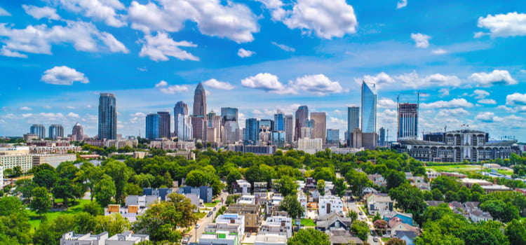 a view of the charlotte skyline on a clear, sunny day