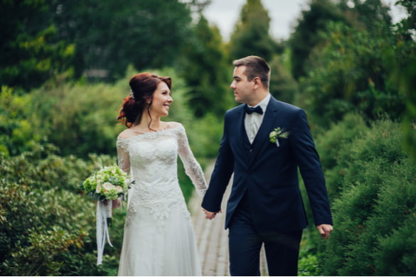 bride and groom taking wedding photos in the forest 