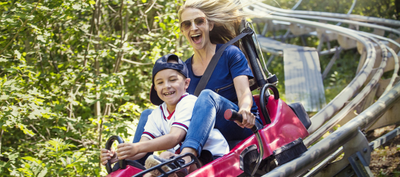 a mother and child at the amusement park