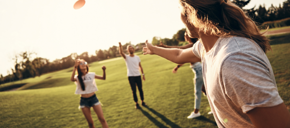 playing frisbee in a park